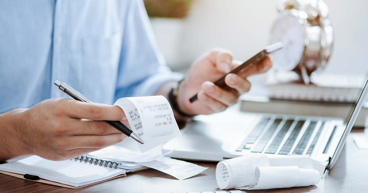 A person calculating finances.