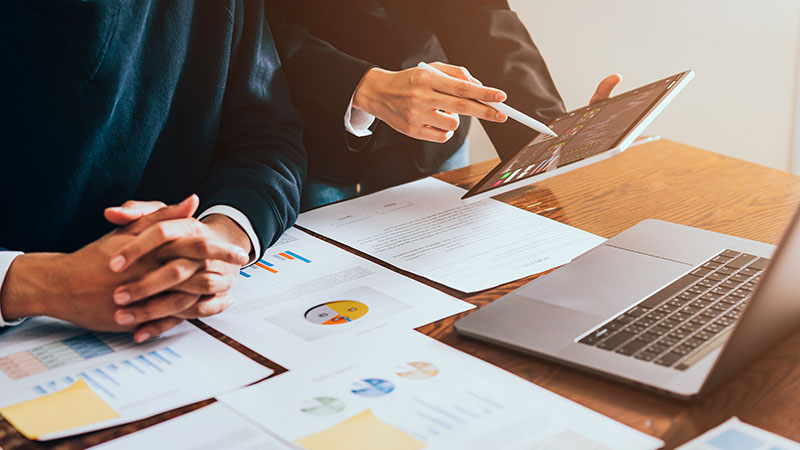 Business team looking over financial charts.