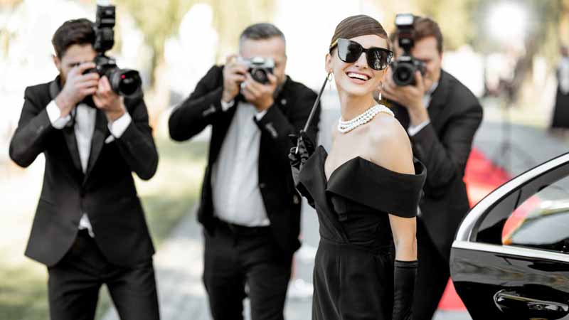 Photographers taking pictures of a celebrity.