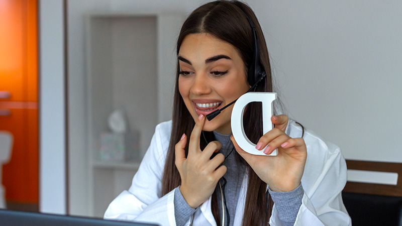 A speech therapist meeting with clients online.