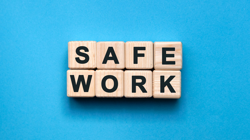 Wooden blocks that spell safe work.