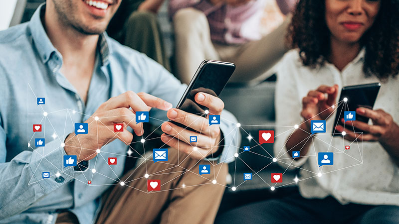 Group of people using social media on smartphones.