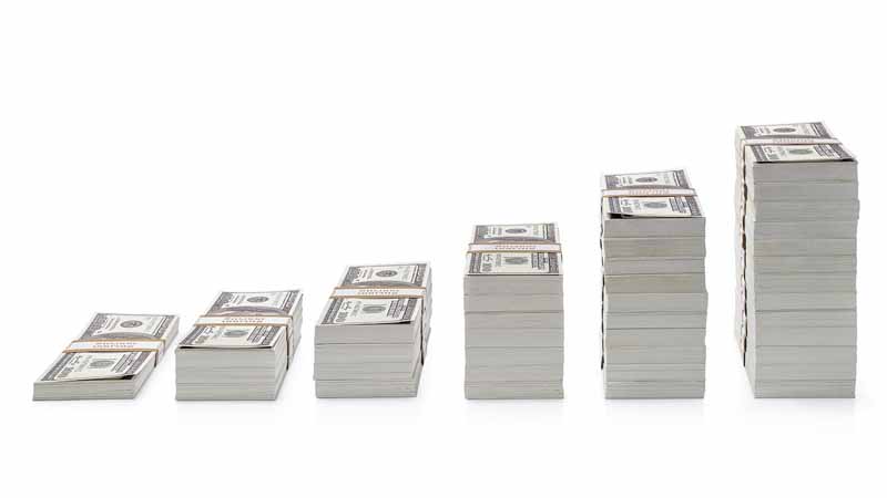 Dollar bills stacked up.