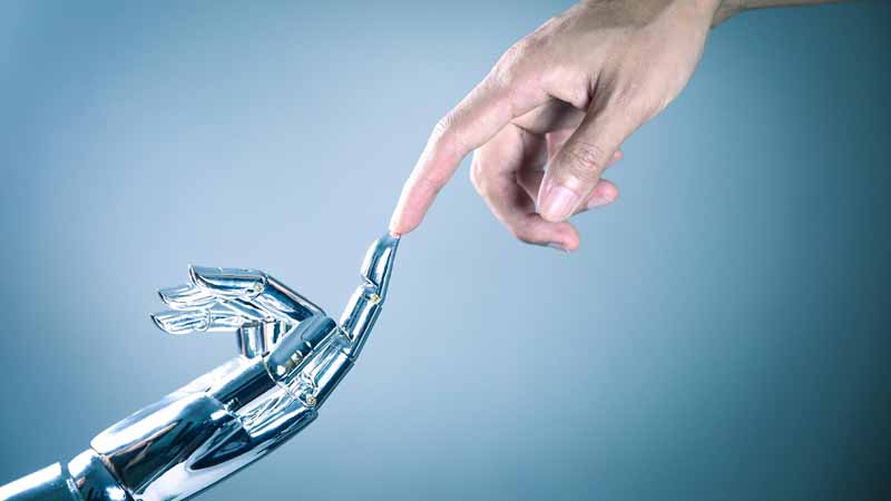 AI Machine, robot hand touching a human hand.