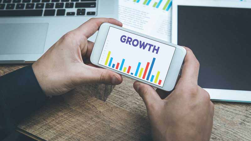 A smartphone with a graph that says growth concept.