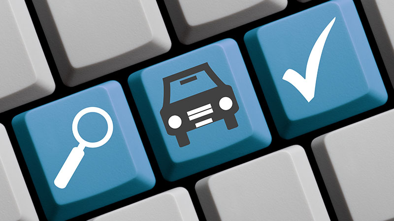 Keyboard keys with a magnifying glass, a car, and a check mark.