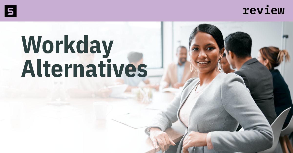 Group of people looking at a laptop at Workday alternatives.