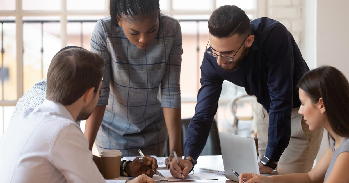 group of people looking up the best resources for starting a business