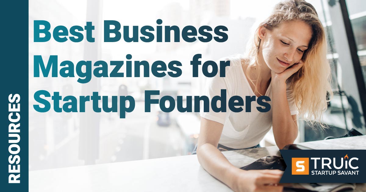 Young smiling people reading a magazine.