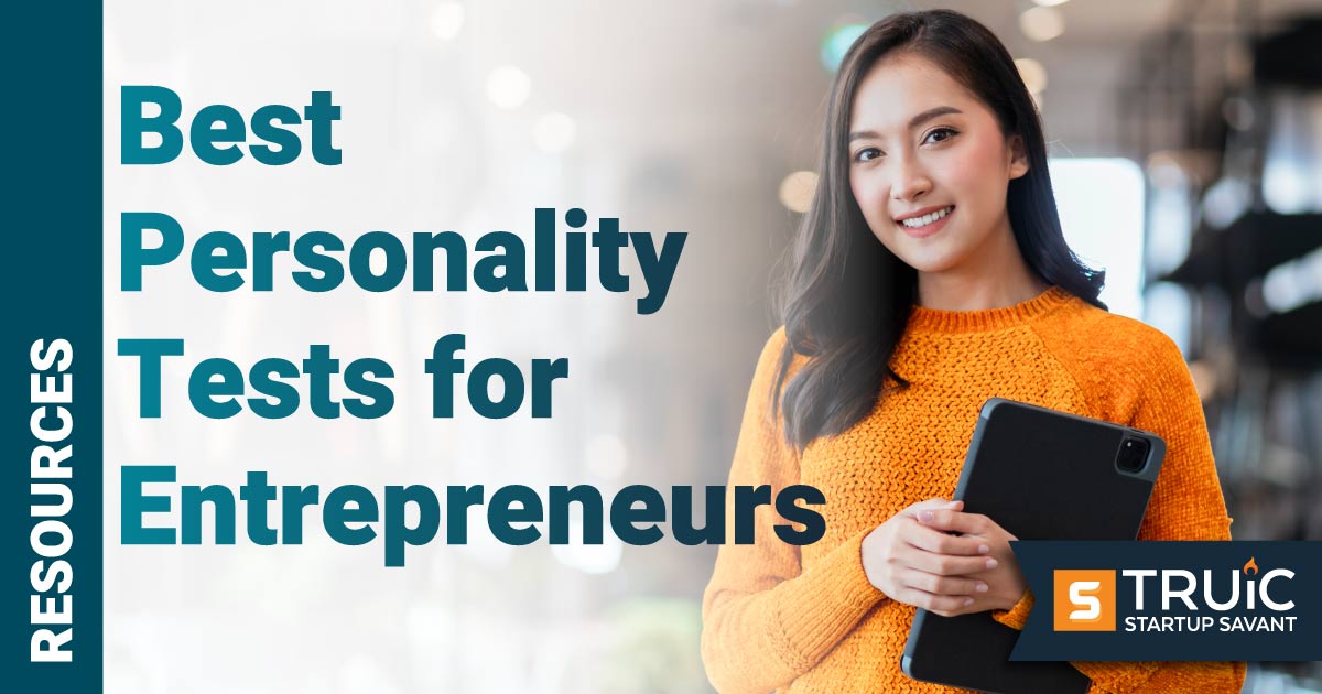 Woman smiling while holding tablet.