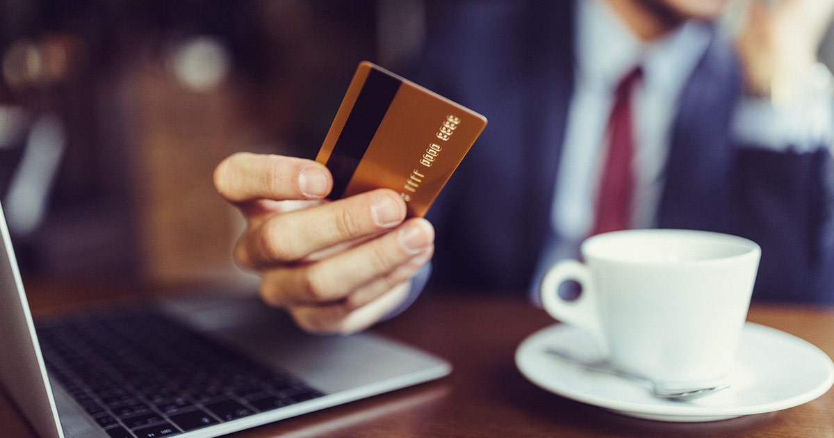 Businessman holding a credit card.