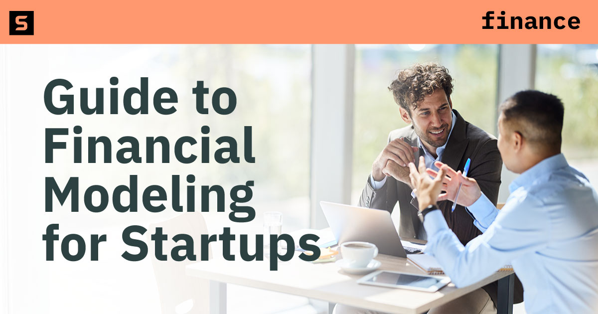 Two people looking at a computer.