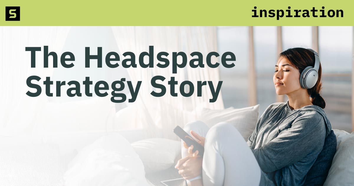 Relaxed woman with eyes closed, headphones on, and holding a phone.