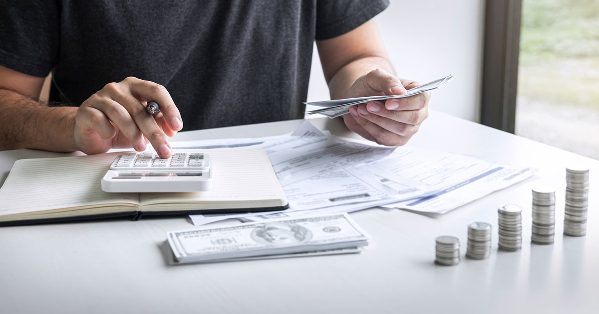 Man with money and calculator.