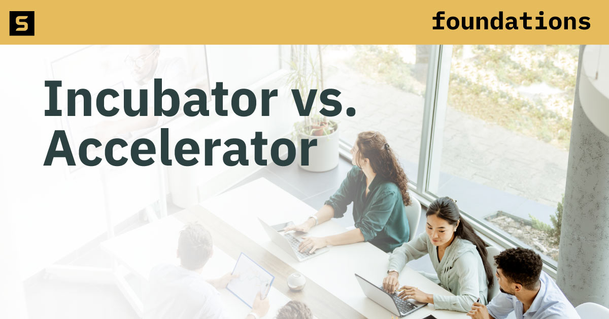 People working at a conference table.