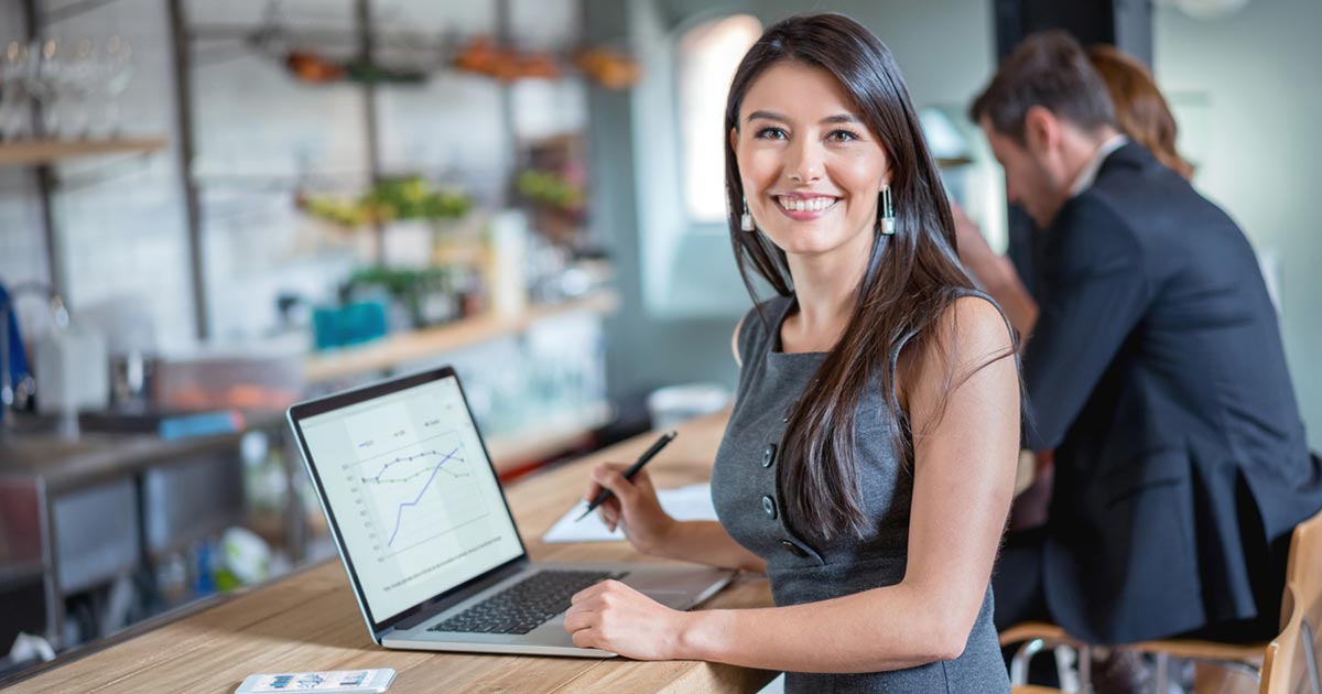 Business woman working on laptop.