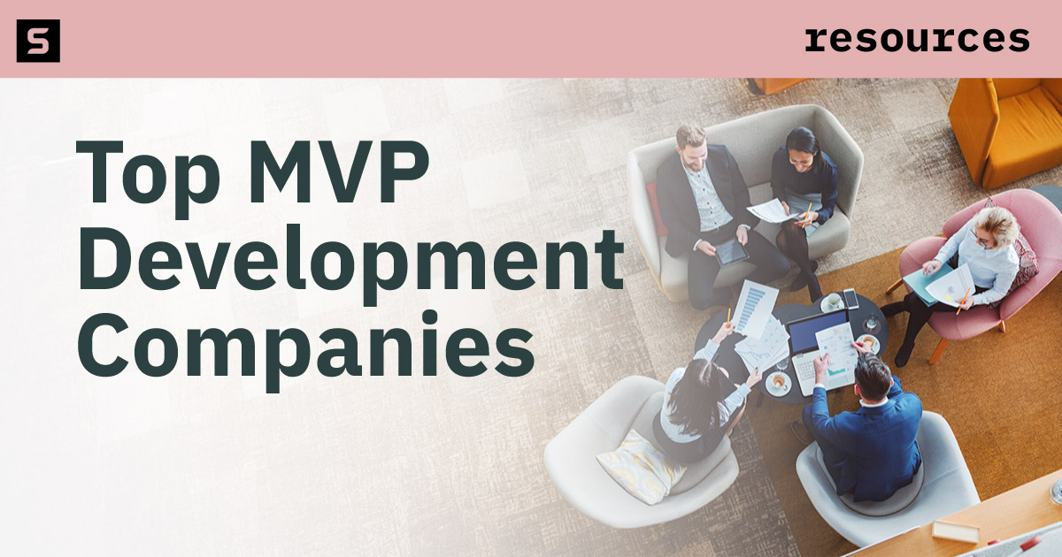 People working at a conference table.