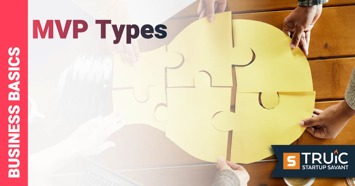 People putting together a puzzle of a lightbulb.