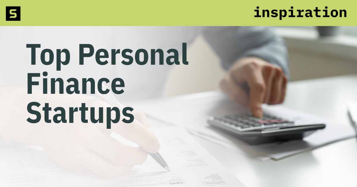 Man sitting at table with computer, coffee mug, and calculator.