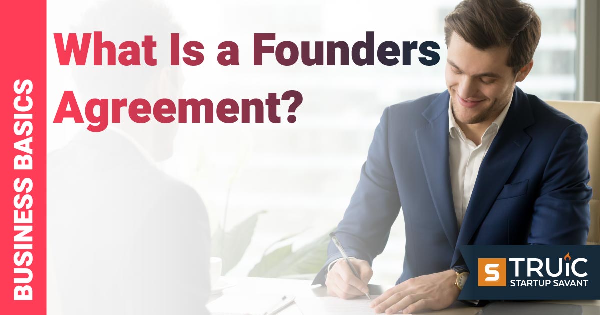 Two people in an office looking over a founders agreement.