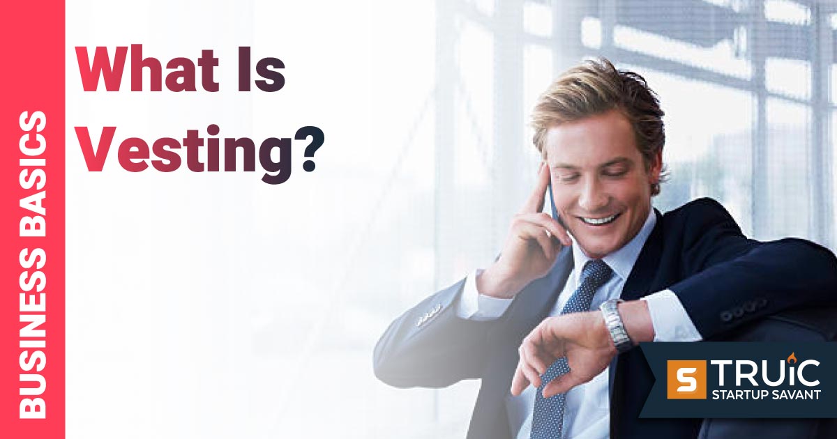 Man in an office looking at his watch.