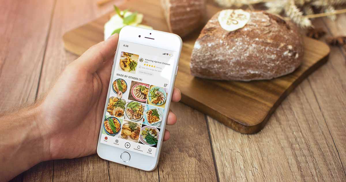 Hand holding phone with Pepper app on screen.