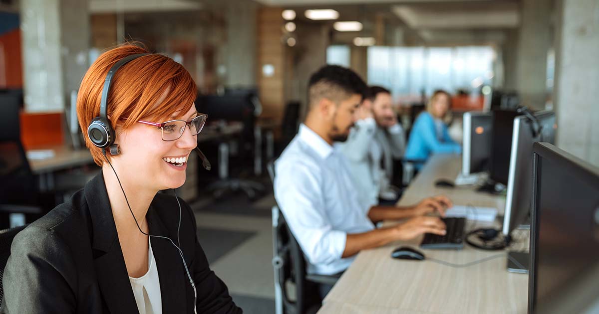 Smiling woman in office.