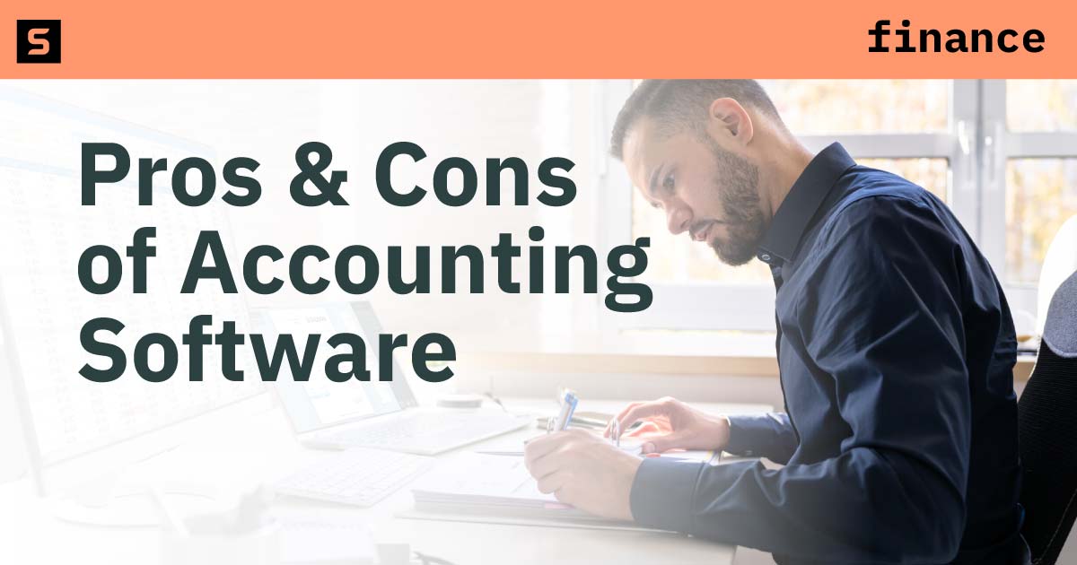 Person using a computer and writing in a notebook.