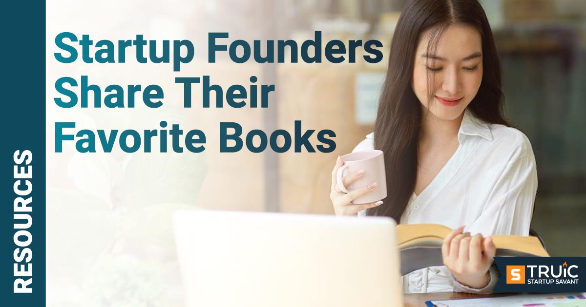 Woman reading book at desk