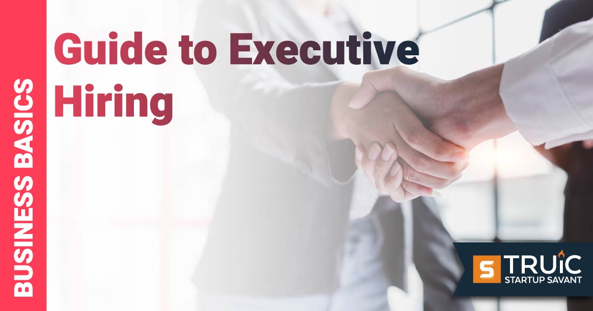 Smiling businesswoman shaking hands with businessman.