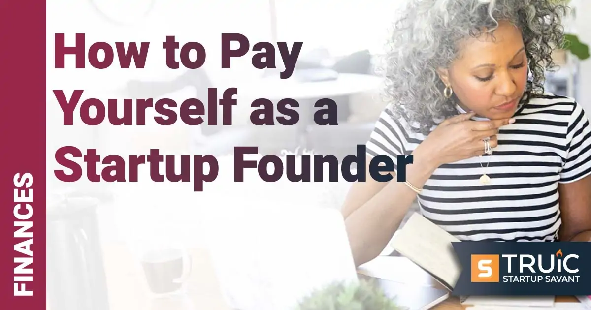 Woman working at home with calculator.