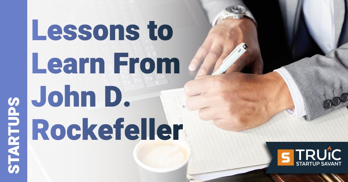 Business man writing notes about startup lessons.