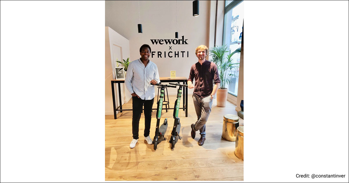 SMOVE.CITY team posing next to electric scooters.