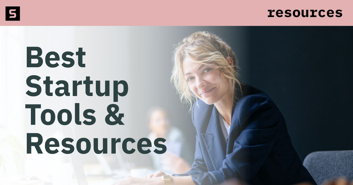 Businessman and businesswoman working at a computer.