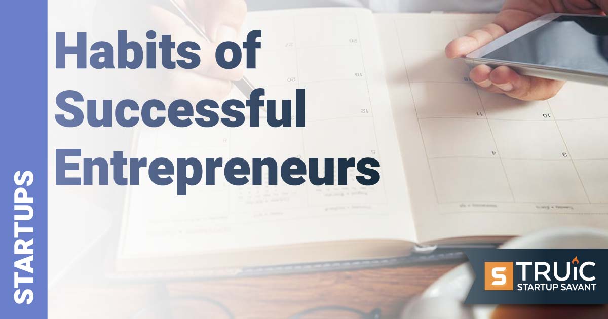 Person writing in planner.