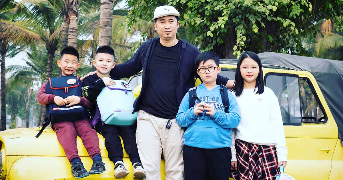 Pak Design founder with children wearing Tinipak.