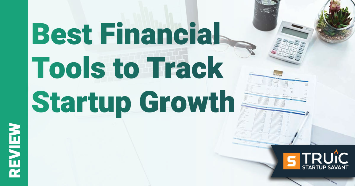 Overhead shot of a desk with financial tools and computer.