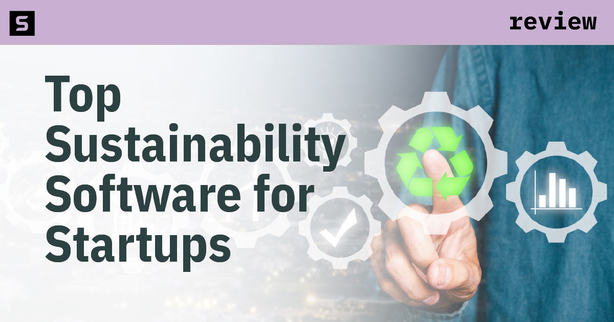 Three people meeting in an office with plants around them.