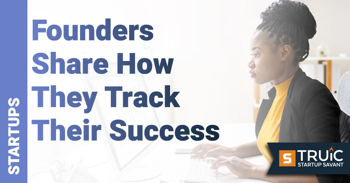 Woman at computer trying to track her progress/success.