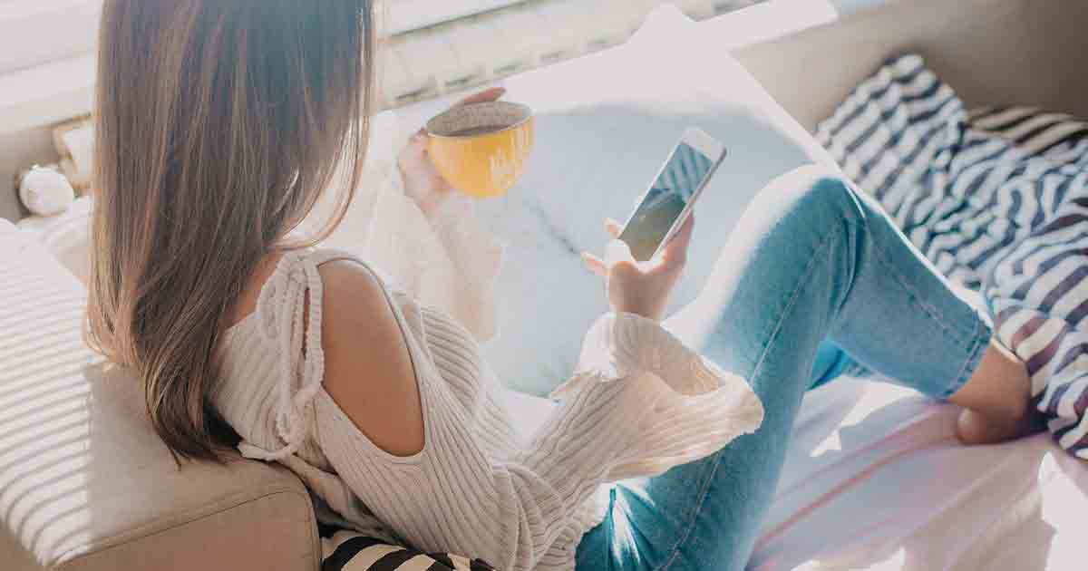 Woman exploring self-care apps.