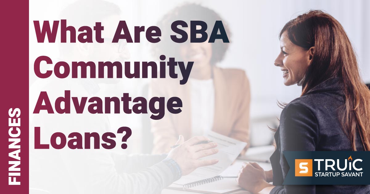 People at a table talking about a SBA community advantage loan.