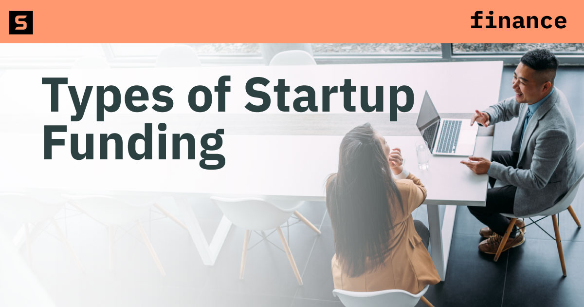 Businesswoman holding a piggy bank.