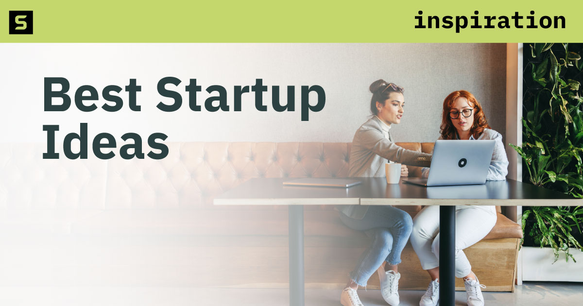 Person holding sticky note with light bulb.