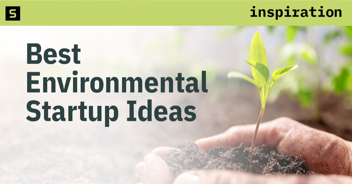 Hands holding a plant growing out of soil.